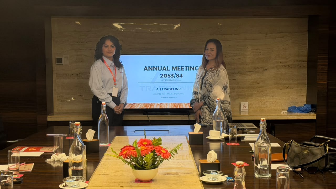Annual meeting portrait of a third team member with the event host.