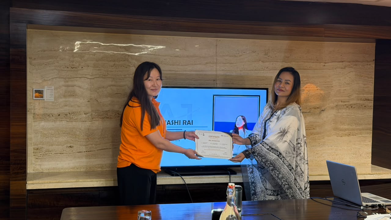 Recognition certificate handover to another team member.