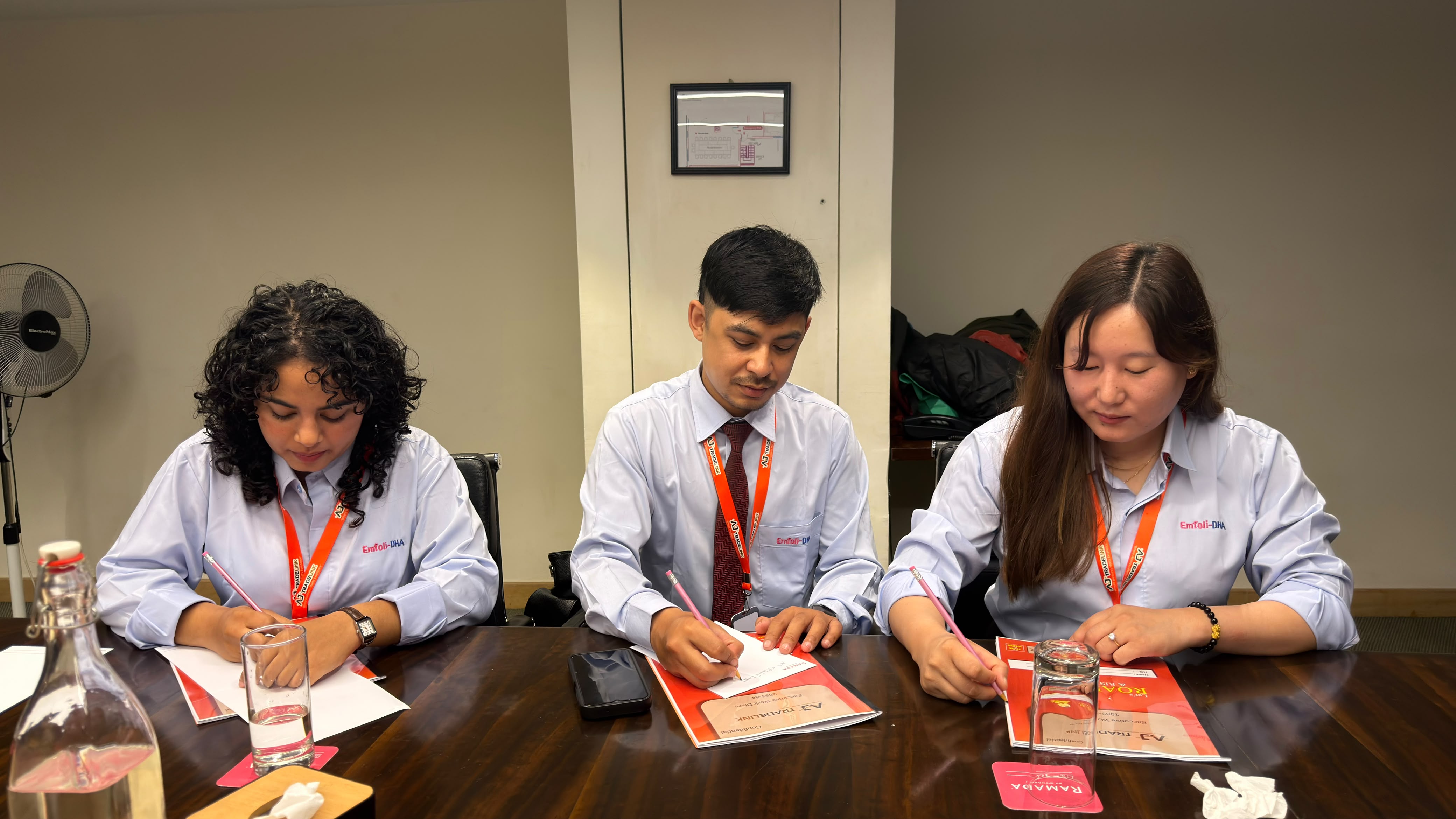 Team members taking notes during the event.